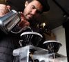 barista making pour over coffee