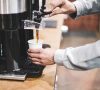 barista pouring coffee